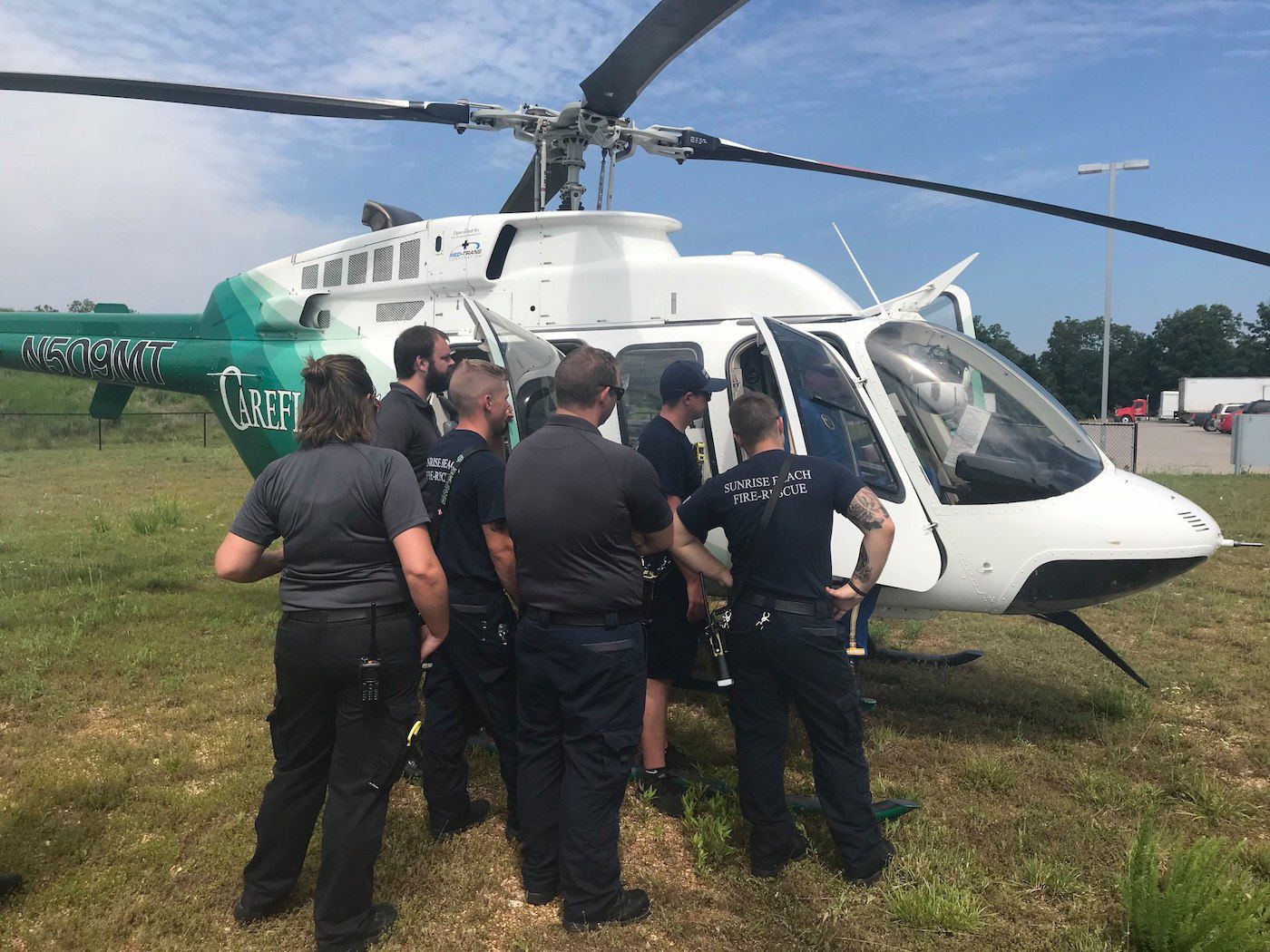 Emergency Service Workers Learn About New Helicopters At The Lake